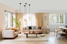 A modern living room featuring minimalist pendant lights creating a sleek and elegant ambiance.