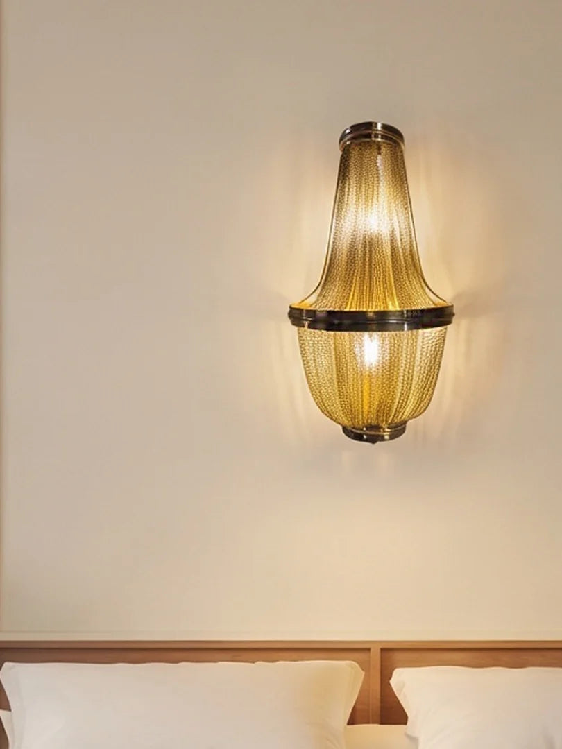 The Golden Grace Wall Chandelier in a bedroom